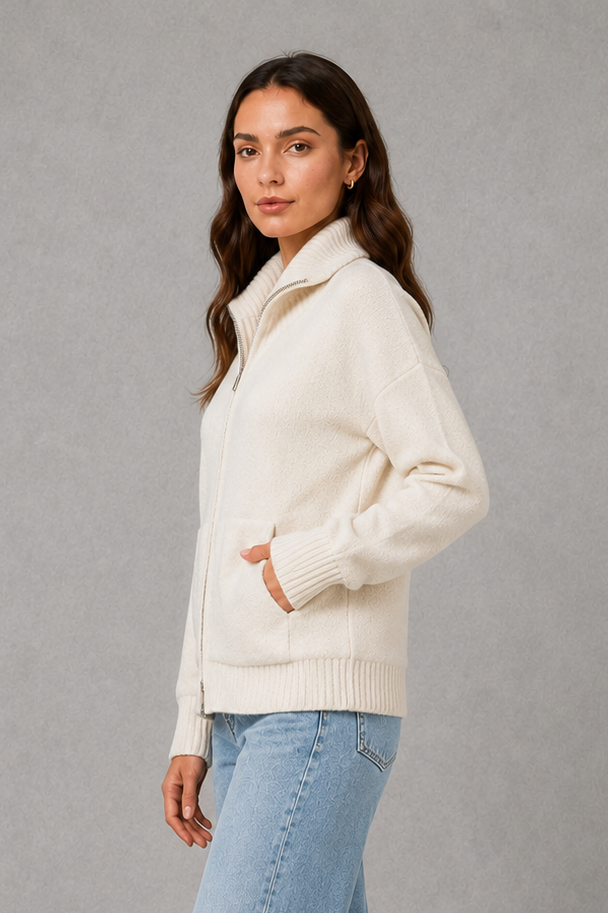 Women’s zip-up funnel neck cardigan with soft knit fabric, full front zipper, patch pockets, long sleeves, and ribbed cuffs and hem.