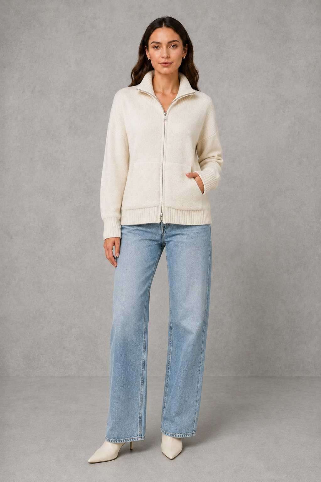 Women’s zip-up funnel neck cardigan with soft knit fabric, full front zipper, patch pockets, long sleeves, and ribbed cuffs and hem.