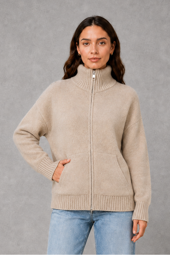 Women’s zip-up funnel neck cardigan with soft knit fabric, full front zipper, patch pockets, long sleeves, and ribbed cuffs and hem.