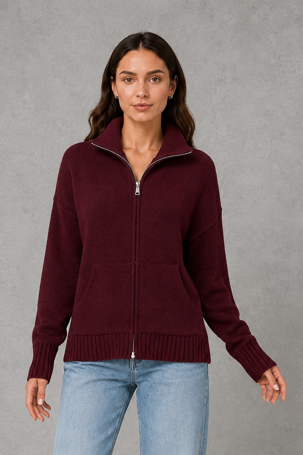 Women’s zip-up funnel neck cardigan with soft knit fabric, full front zipper, patch pockets, long sleeves, and ribbed cuffs and hem.