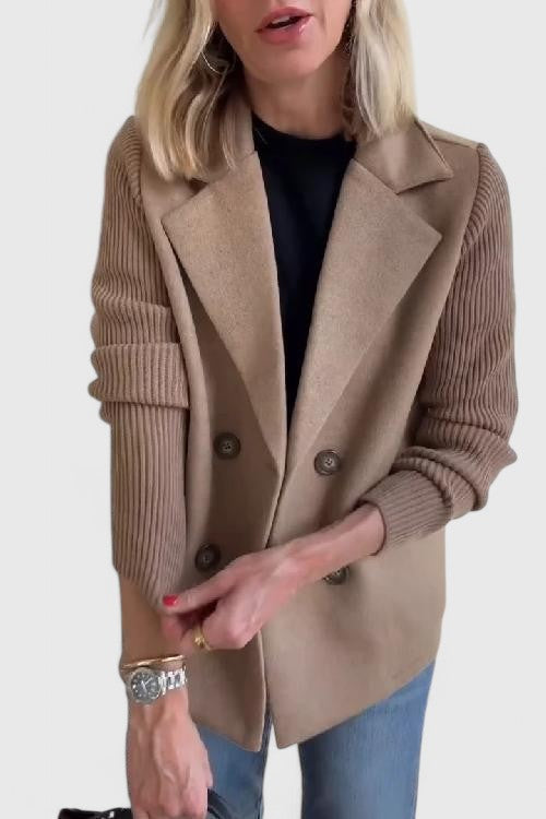 Women’s tailored blazer jacket with contrast sleeves and double-breasted front.
