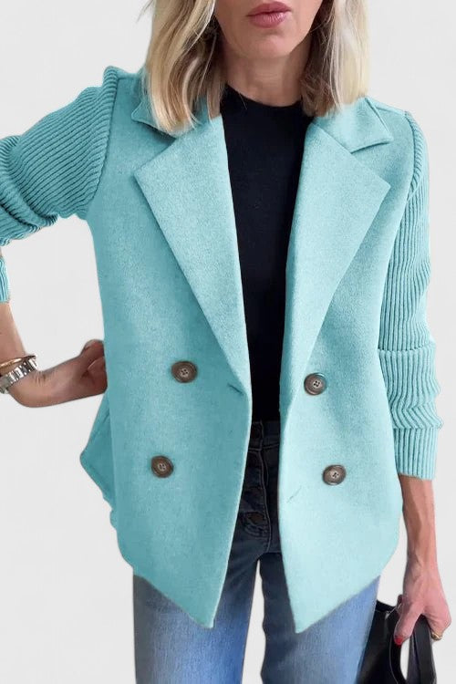 Women’s tailored blazer jacket with contrast sleeves and double-breasted front.