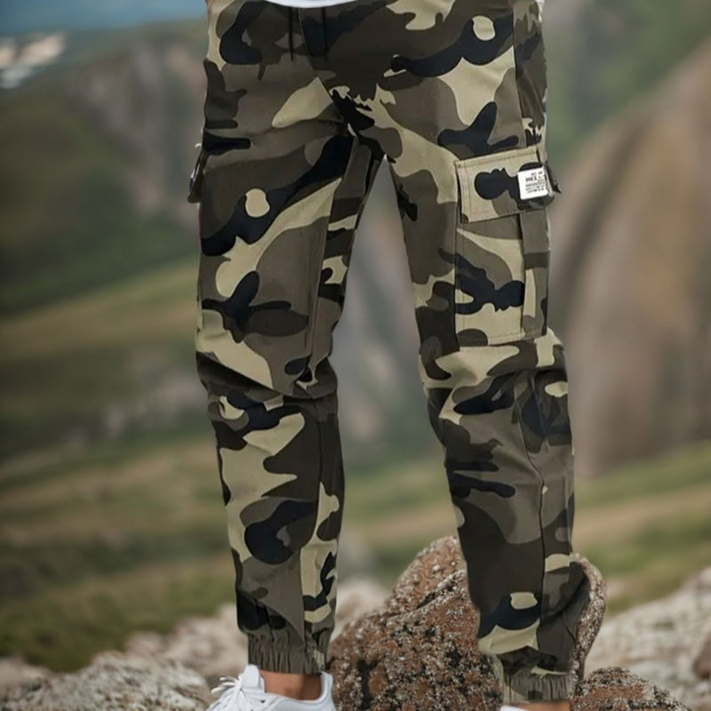 Men’s durable camo cargo work pants with multiple pockets, straight-leg fit, and rugged cotton-polyester fabric for work, outdoor activities, and everyday wear.
