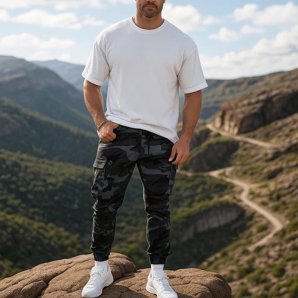Men’s durable camo cargo work pants with multiple pockets, straight-leg fit, and rugged cotton-polyester fabric for work, outdoor activities, and everyday wear.