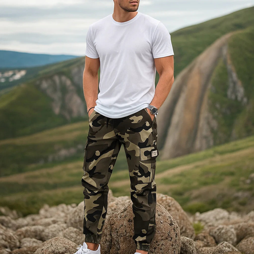 Men’s durable camo cargo work pants with multiple pockets, straight-leg fit, and rugged cotton-polyester fabric for work, outdoor activities, and everyday wear.