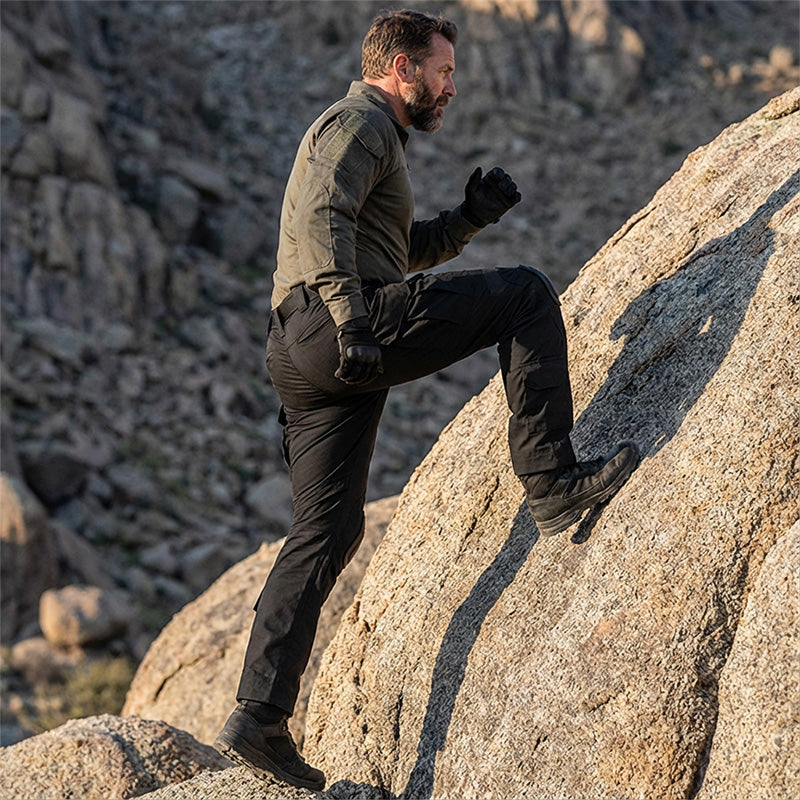 Men’s tactical cargo pants with integrated knee pads, adjustable straps, multiple pockets, and durable cotton-polyester fabric for outdoor work and rugged activities.