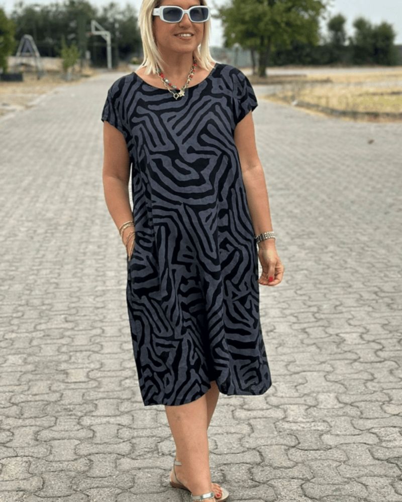 Women’s cotton A-line vintage dress with flared sleeves and relaxed fit.