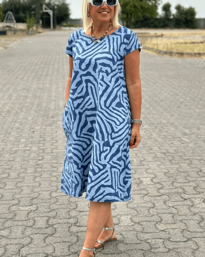 Women’s cotton A-line vintage dress with flared sleeves and relaxed fit.