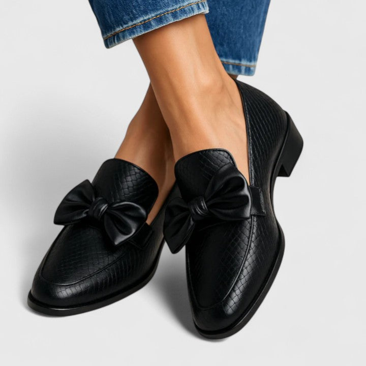 Women’s slip-on loafers with oversized bow and comfortable supportive sole.