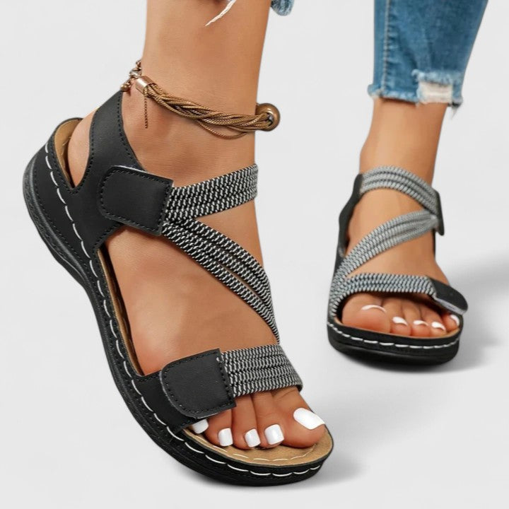 Women’s cushioned support sandals with structured footbed designed for stable and comfortable everyday walking.