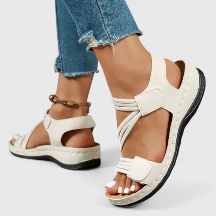 Women’s cushioned support sandals with structured footbed designed for stable and comfortable everyday walking.