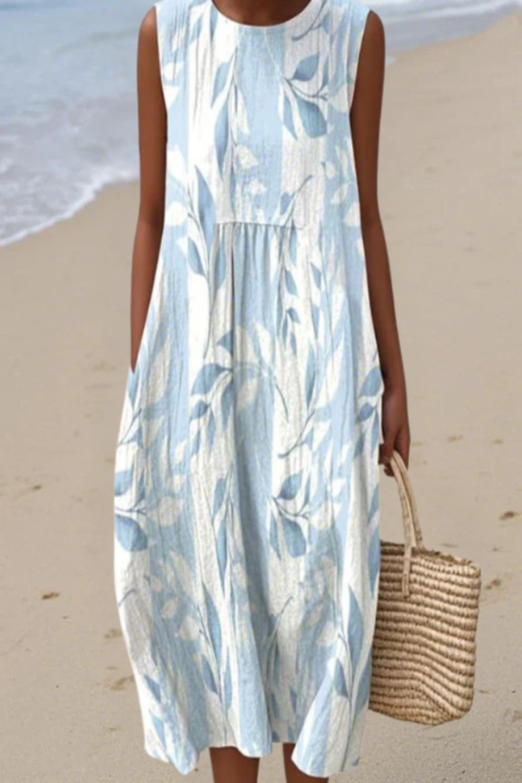 Women’s midi dress with a subtle leaf print and relaxed silhouette designed for lightweight and comfortable everyday wear.