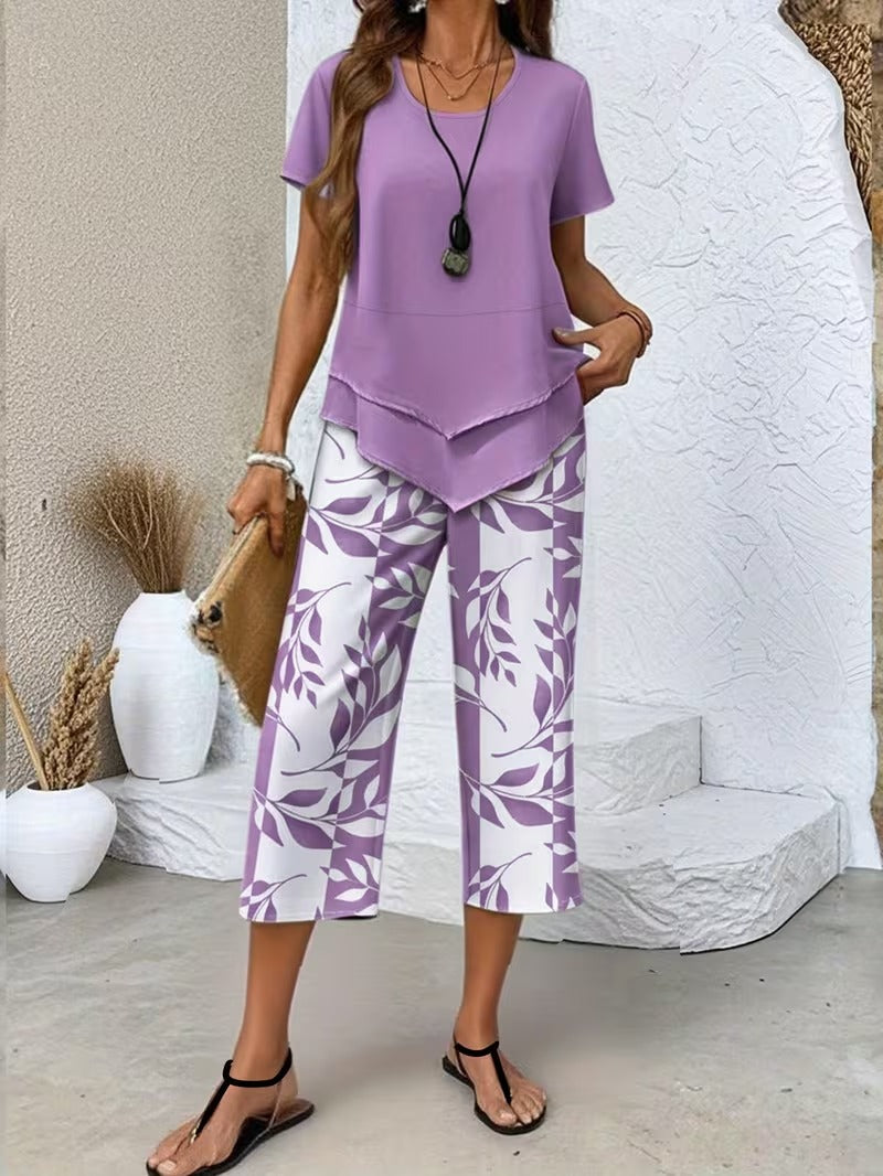 Women’s two-piece outfit featuring a relaxed top and leaf print trousers designed for lightweight and comfortable everyday wear.
