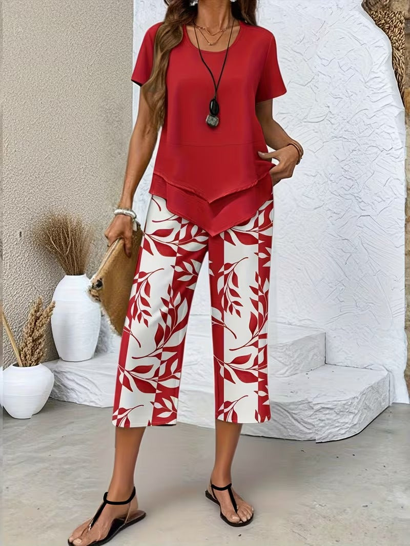 Women’s two-piece outfit featuring a relaxed top and leaf print trousers designed for lightweight and comfortable everyday wear.
