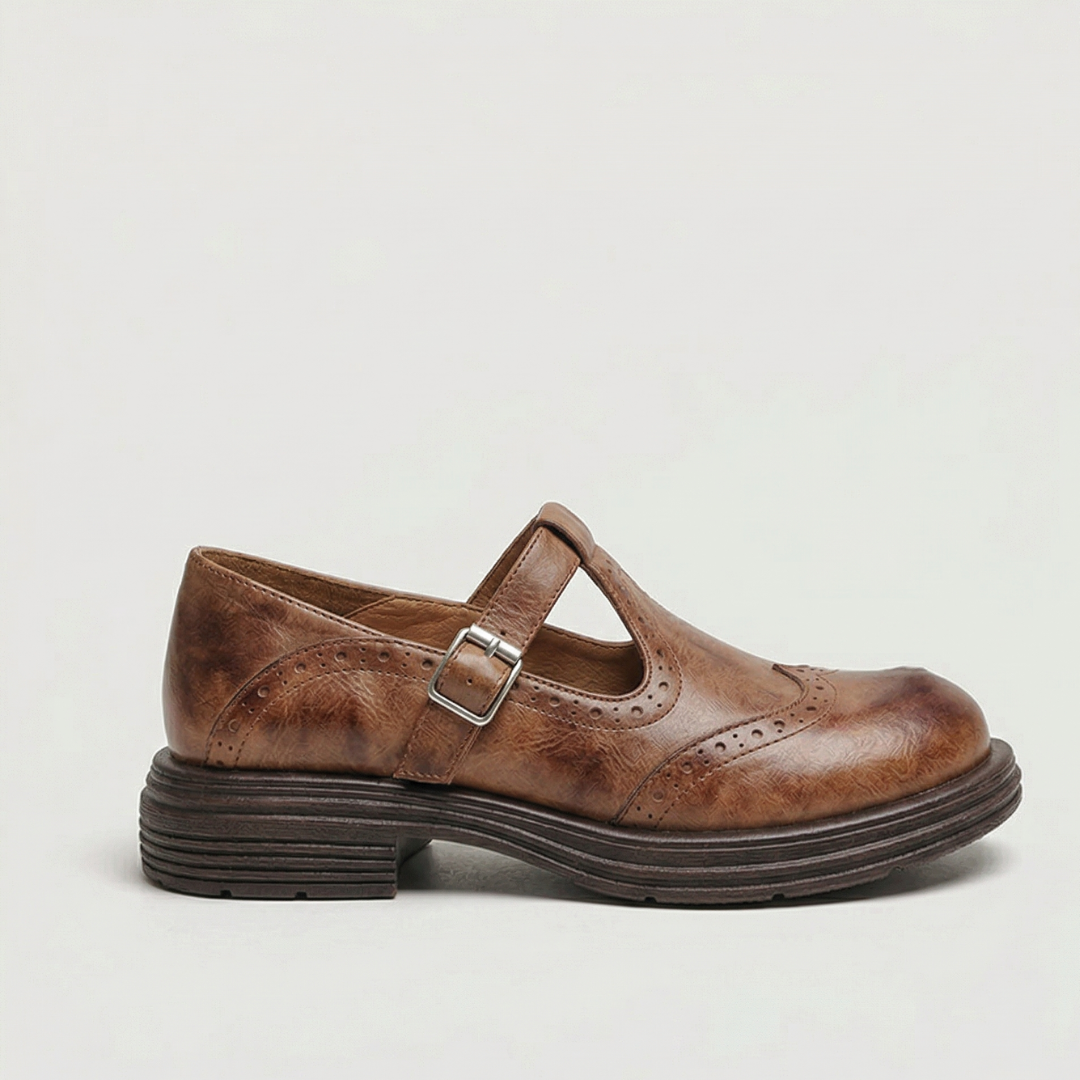 Women’s leather Mary Jane shoes with strap and cushioned sole designed for comfortable everyday walking.