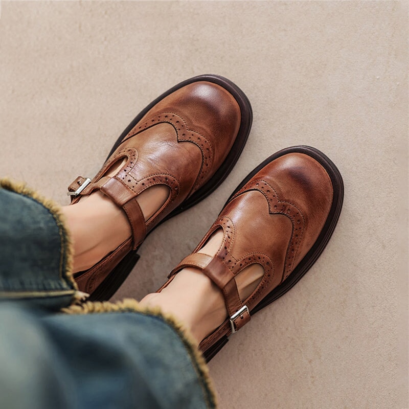 Women’s leather Mary Jane shoes with strap and cushioned sole designed for comfortable everyday walking.