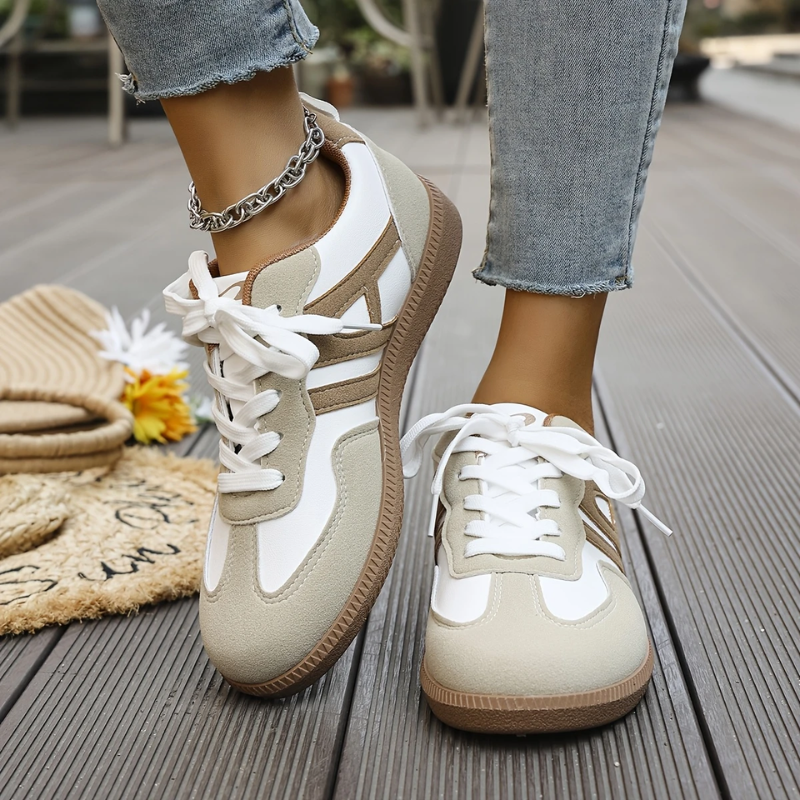 Women’s lightweight comfort sneakers with breathable mesh upper, cushioned insole, and lace-up design for everyday walking.