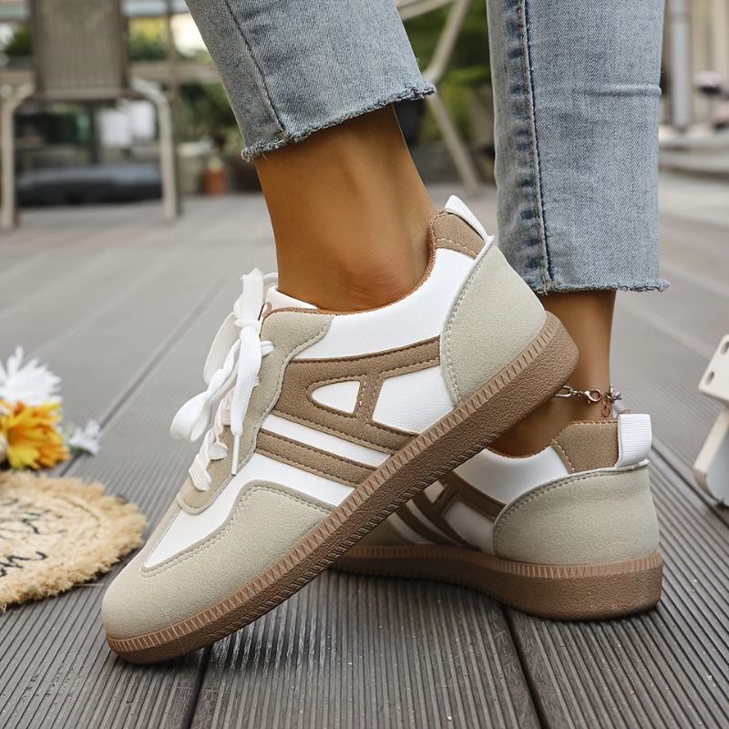 Women’s lightweight comfort sneakers with breathable mesh upper, cushioned insole, and lace-up design for everyday walking.