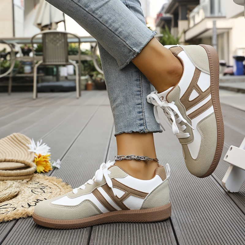 Women’s lightweight comfort sneakers with breathable mesh upper, cushioned insole, and lace-up design for everyday walking.