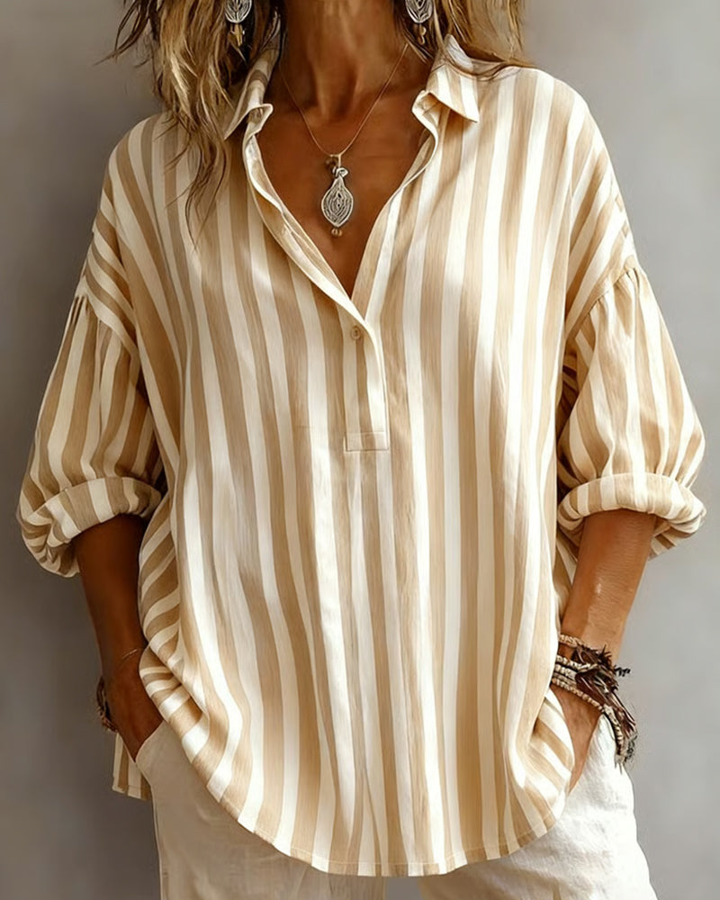 Women’s loose striped blouse with collar, relaxed fit, breathable fabric, and timeless vertical stripes for casual and versatile styling.