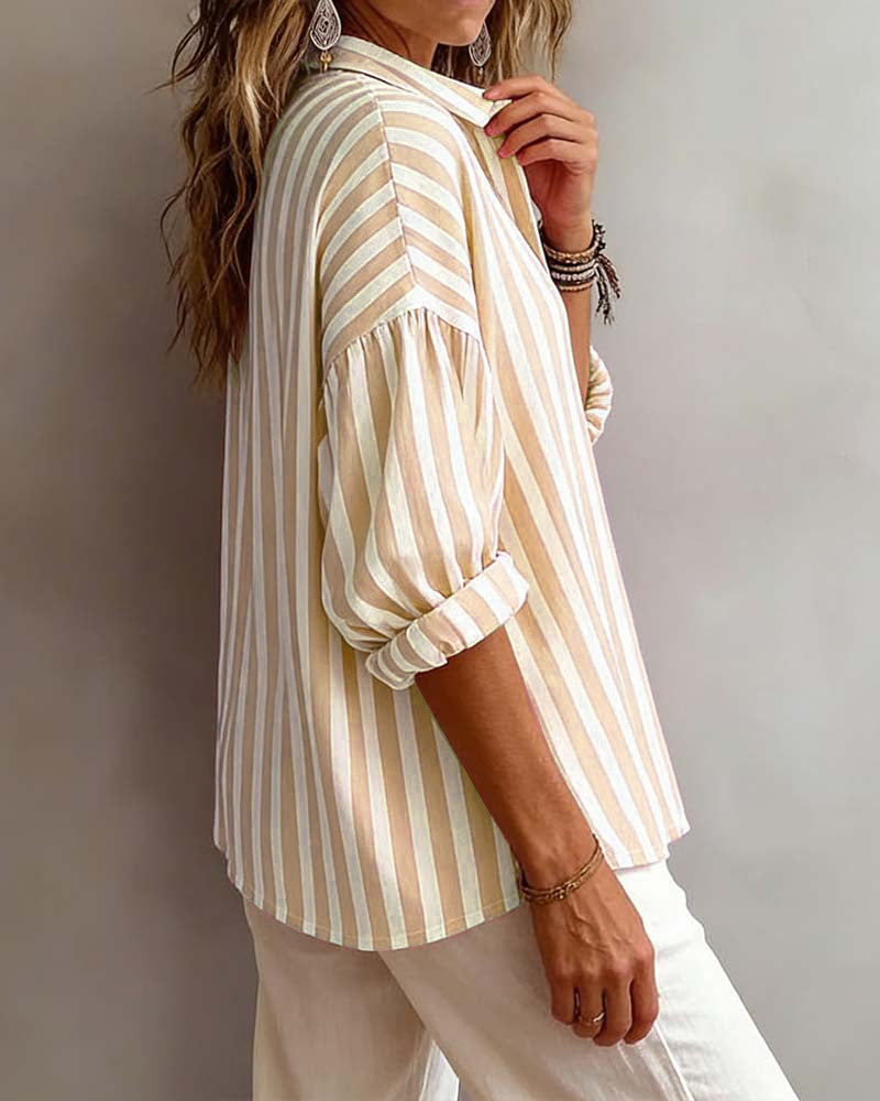 Women’s loose striped blouse with collar, relaxed fit, breathable fabric, and timeless vertical stripes for casual and versatile styling.