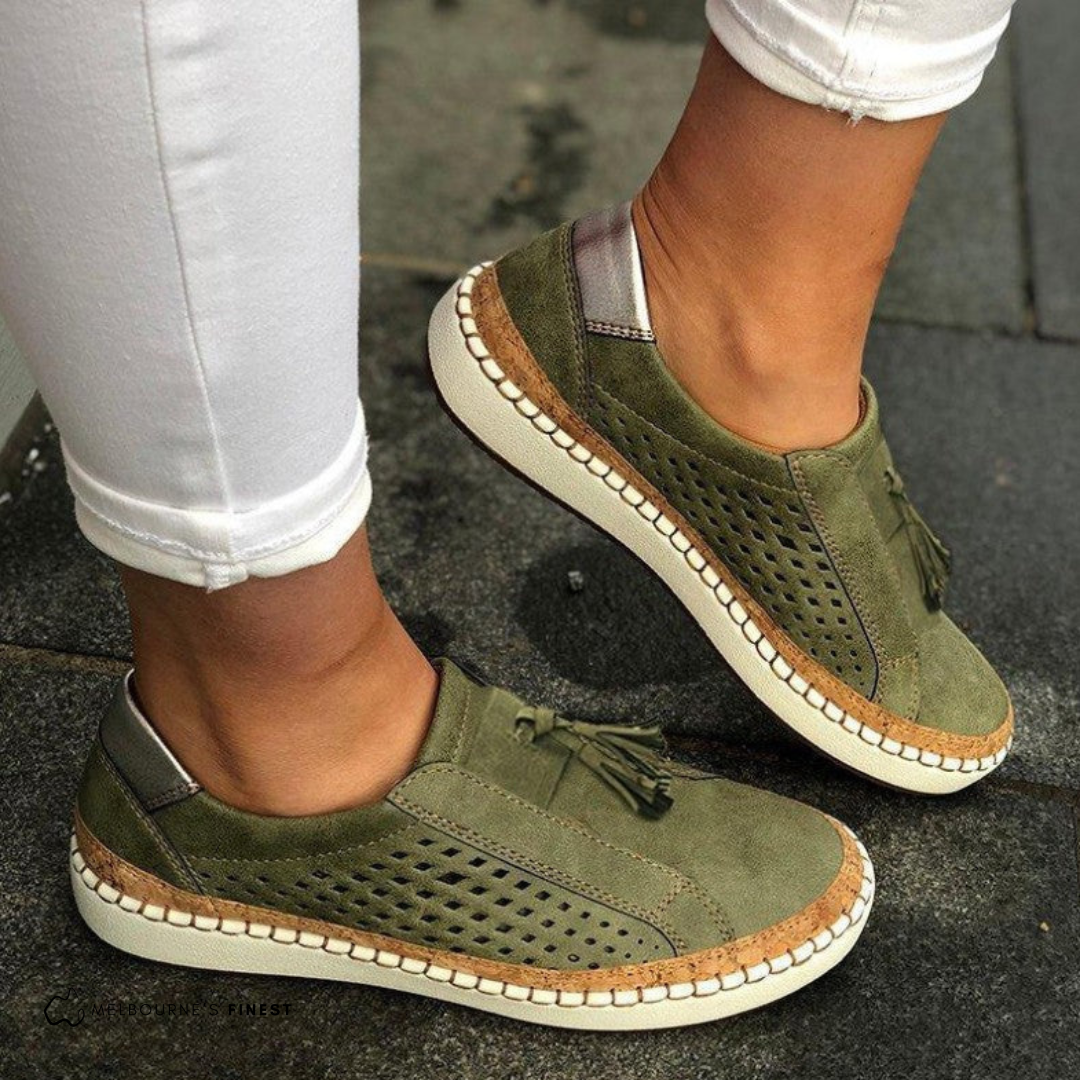 Women’s comfortable slip-on sneakers with breathable fabric and cushioned sole for everyday wear.