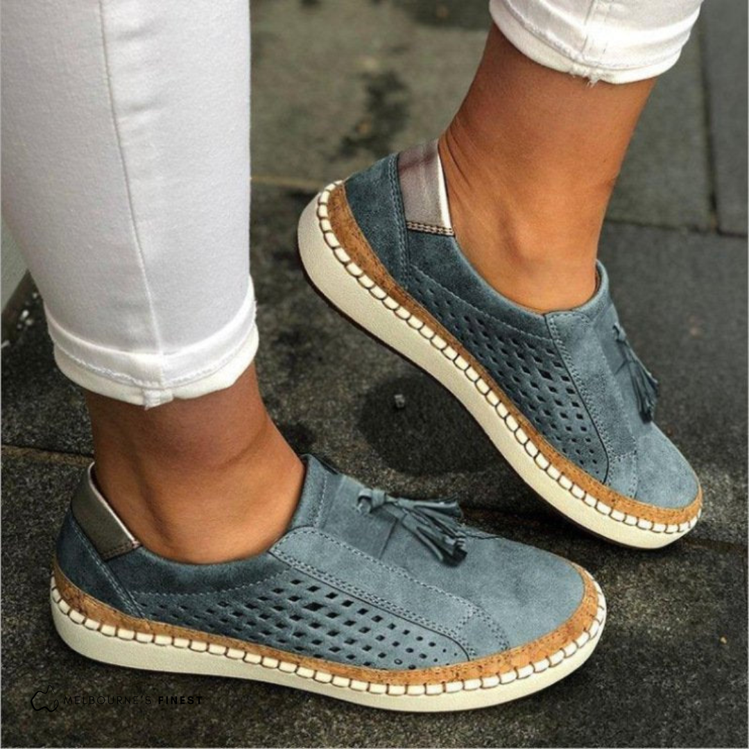 Women’s comfortable slip-on sneakers with breathable fabric and cushioned sole for everyday wear.