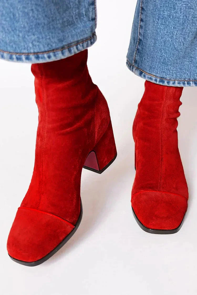Women’s suede ankle boots with stable block heel and cushioned insole designed for comfortable everyday wear.