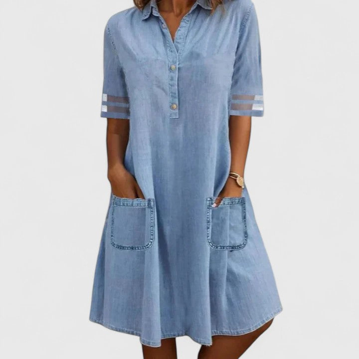Women’s denim dress with half-button front, patch pockets, and relaxed tummy-covering fit, perfect for casual styling.