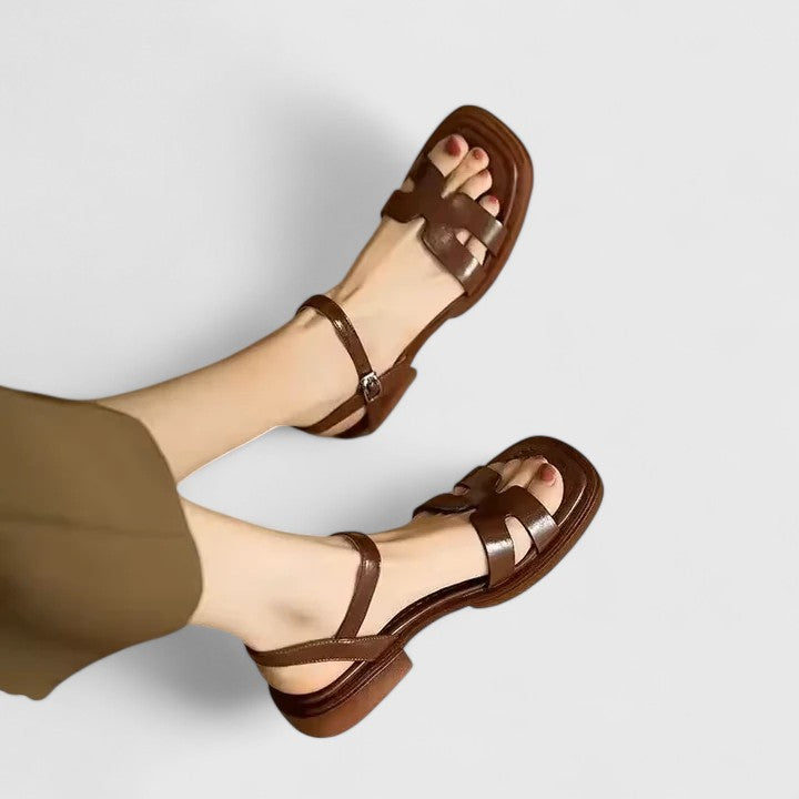 Women wearing leather block heel sandals with adjustable ankle strap