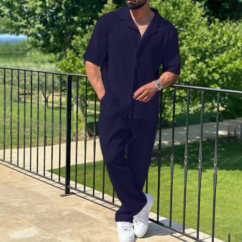 Men’s pleated two piece set with camp collar short sleeve shirt and straight leg trousers in lightweight textured fabric