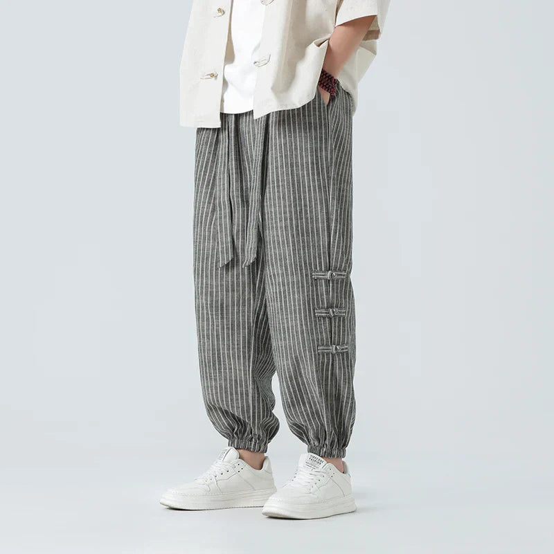 Men’s striped linen tapered trousers with elastic drawstring waistband and cuffed ankles for casual summer wear