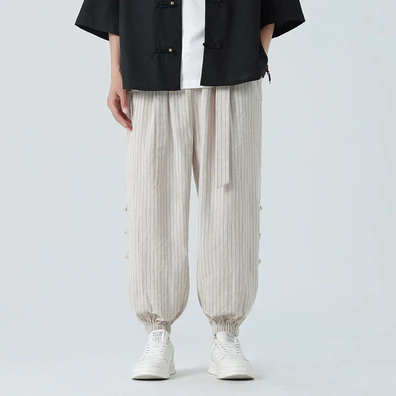 Men’s striped linen tapered trousers with elastic drawstring waistband and cuffed ankles for casual summer wear