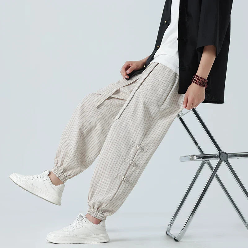 Men’s striped linen tapered trousers with elastic drawstring waistband and cuffed ankles for casual summer wear