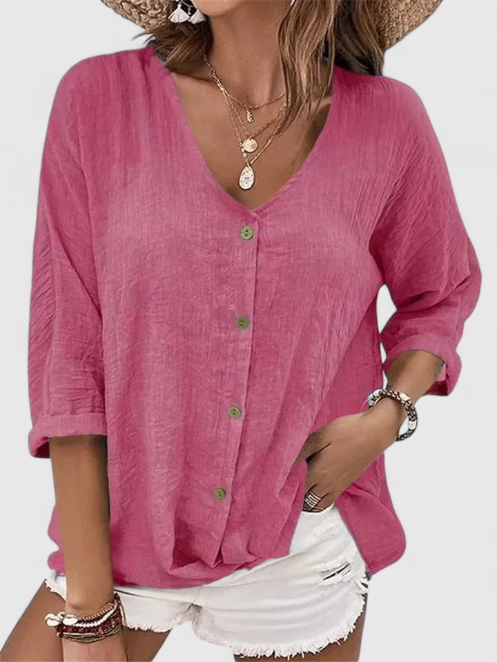 Women wearing a lightweight V-neck blouse with button detail