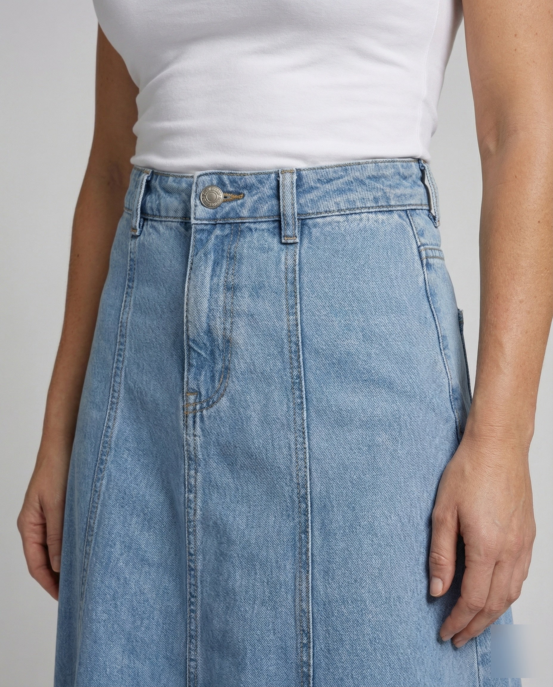 Women’s A-line denim panel skirt with high waist and flowing silhouette
