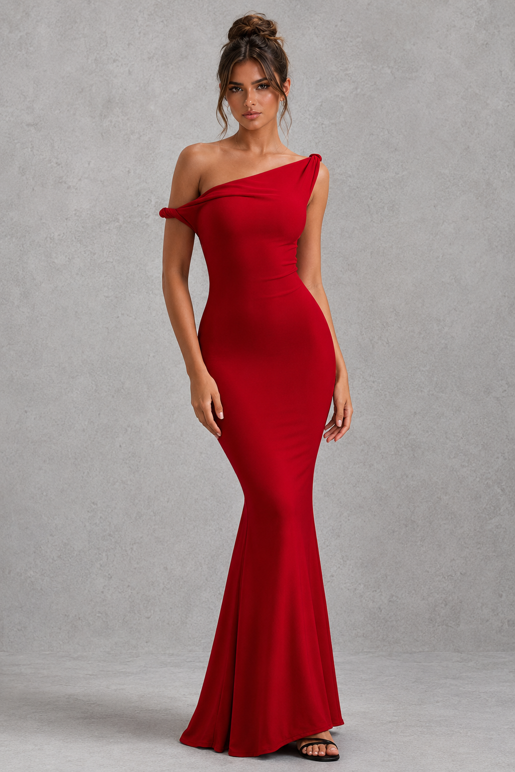 Woman wearing a women’s asymmetric bodycon maxi dress in premium double-layered stretch jersey with a twisted one-shoulder neckline, sleeveless fitted silhouette, and floor-length design for evening and formal occasions.