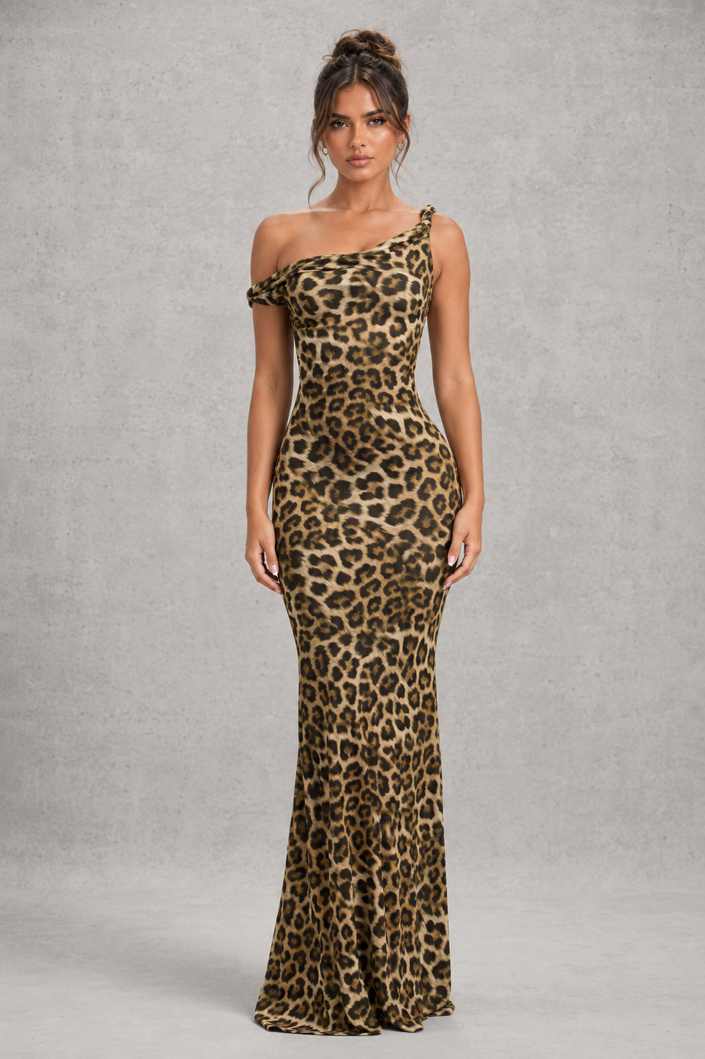 Woman wearing a women’s asymmetric bodycon maxi dress in premium double-layered stretch jersey with a twisted one-shoulder neckline, sleeveless fitted silhouette, and floor-length design for evening and formal occasions.