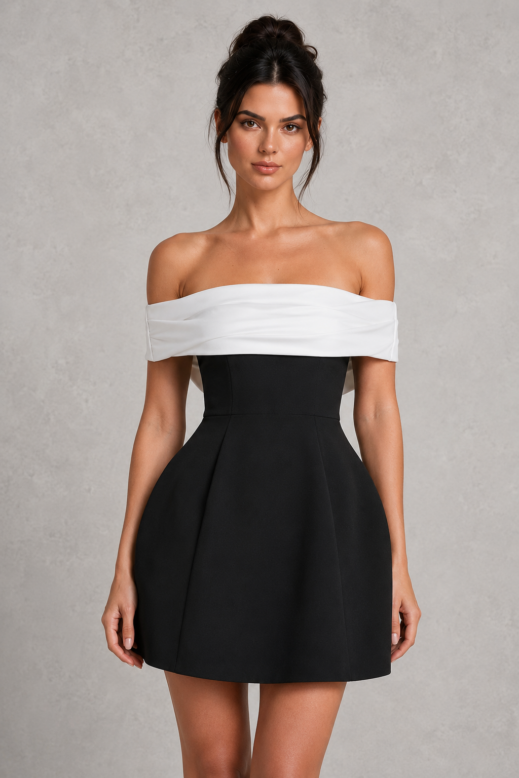 Woman wearing a Bardot off-the-shoulder mini dress with a fitted crepe bodice, contrast neckline, voluminous bubble skirt, and statement bow detail at the back for parties and special occasions.