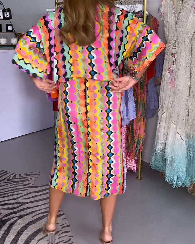 Women’s colorful geometric print V-neck midi dress with half sleeves