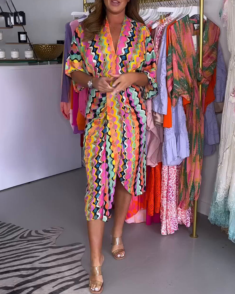 Women’s colorful geometric print V-neck midi dress with half sleeves