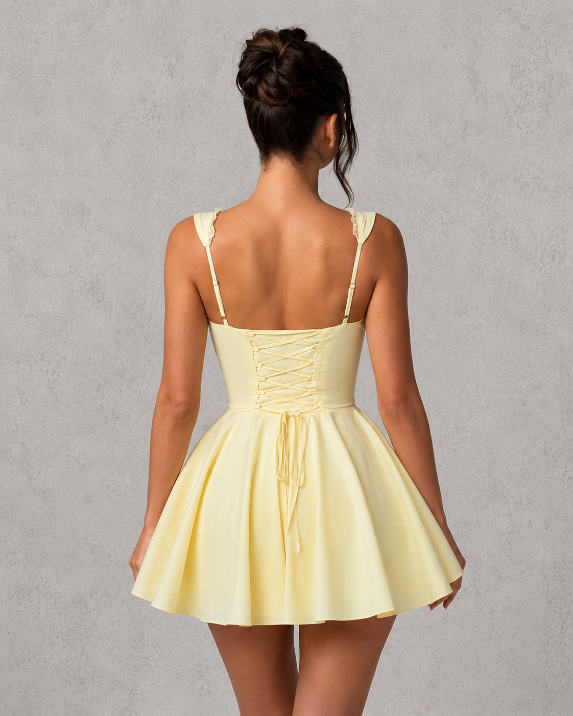 Women's corset mini dress with a structured bodice, pintuck detailing, button-front bust, decorative underbust tie, adjustable fan-shaped straps, lace-up back, and a voluminous full skirt, crafted from a lightweight nylon cotton blend for parties, brunches, and special occasions.