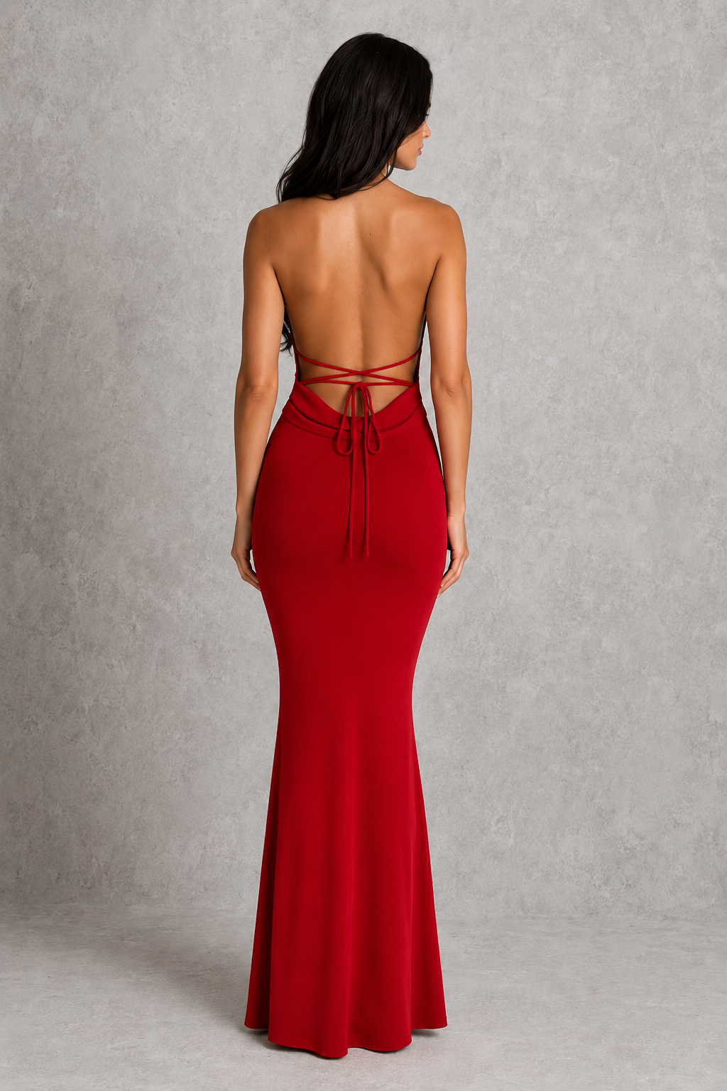 Women's cowl neck maxi dress in premium textured jersey featuring a figure-hugging silhouette, elegant draped neckline, dramatic open low-back design with adjustable tie straps, and floor-length hem for formal evening occasions.