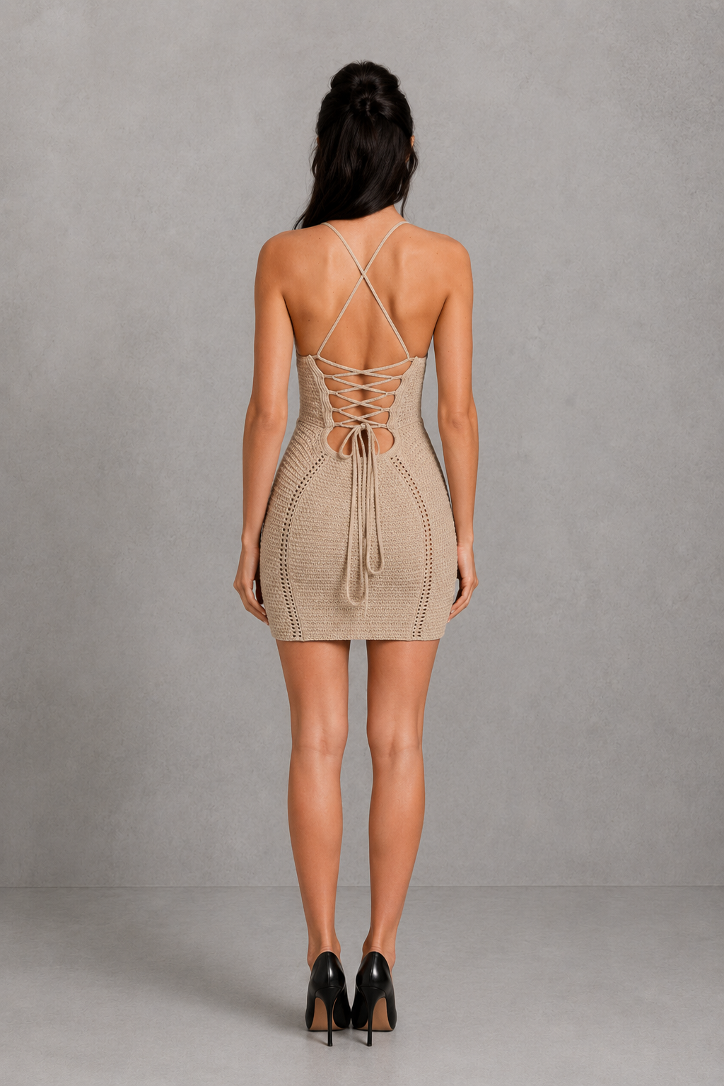Women's crochet knit mini dress featuring structured triangle cups, boned bodice, body-contouring fit, and an open lace-up back. The textured faux crochet fabric and mini-length silhouette create a chic bohemian-inspired look for parties, summer events, and special occasions.