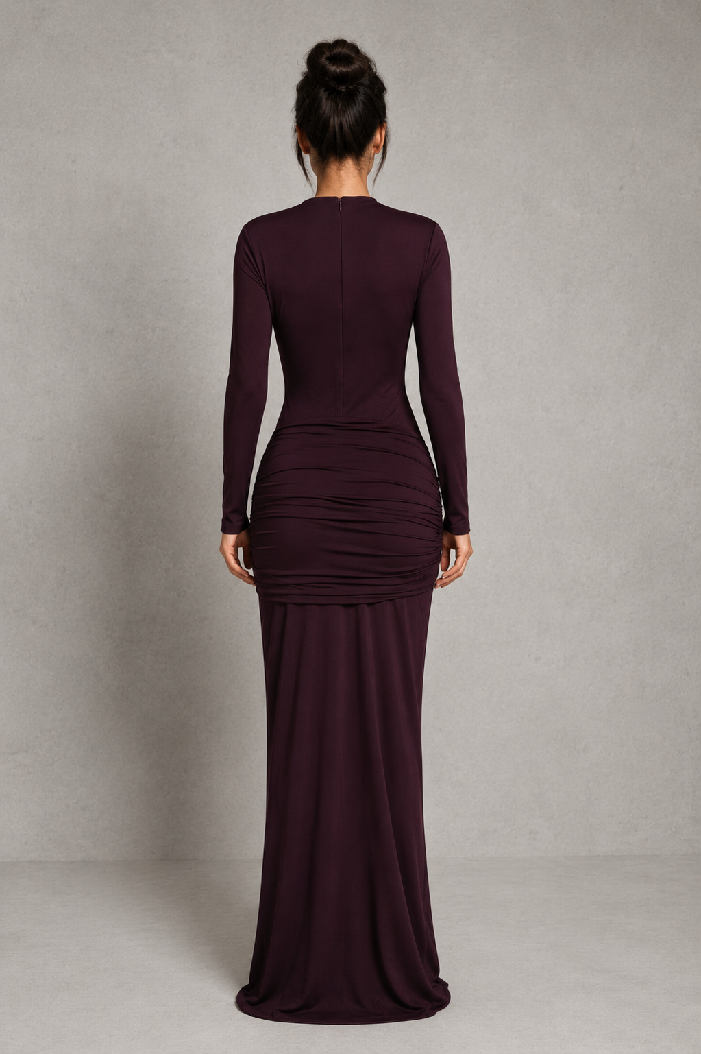 Women's black cut-out maxi dress with a high neckline, long sleeves, draped tie-front hip detail, and fitted stretch silhouette for evening and formal occasions.