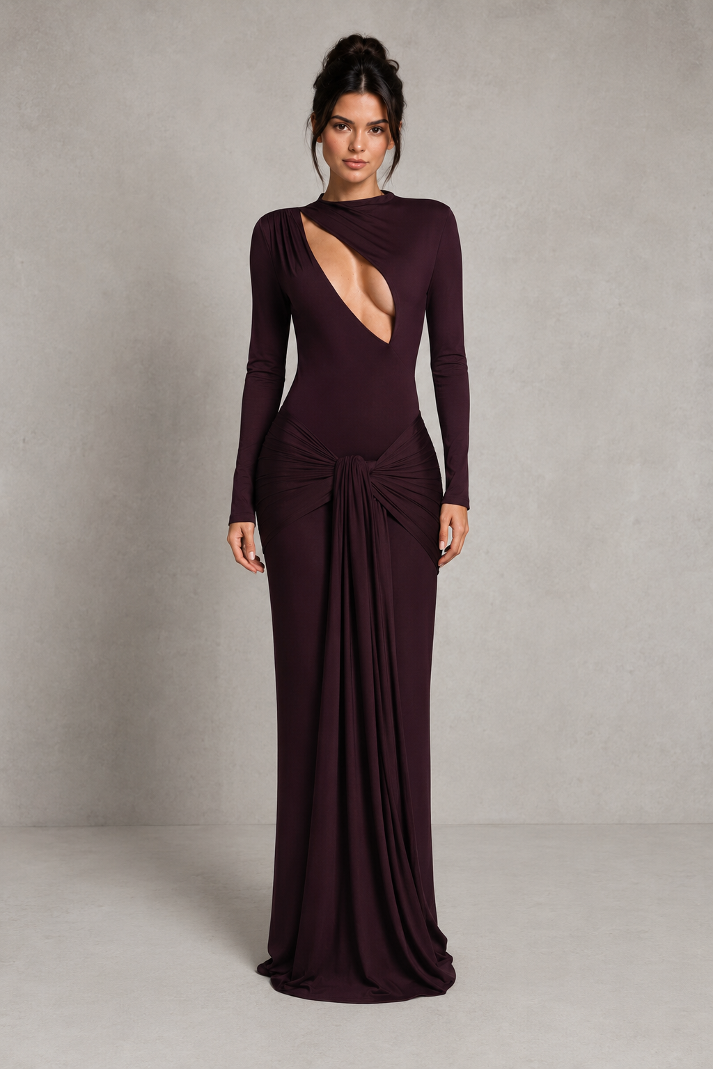 Women's black cut-out maxi dress with a high neckline, long sleeves, draped tie-front hip detail, and fitted stretch silhouette for evening and formal occasions.