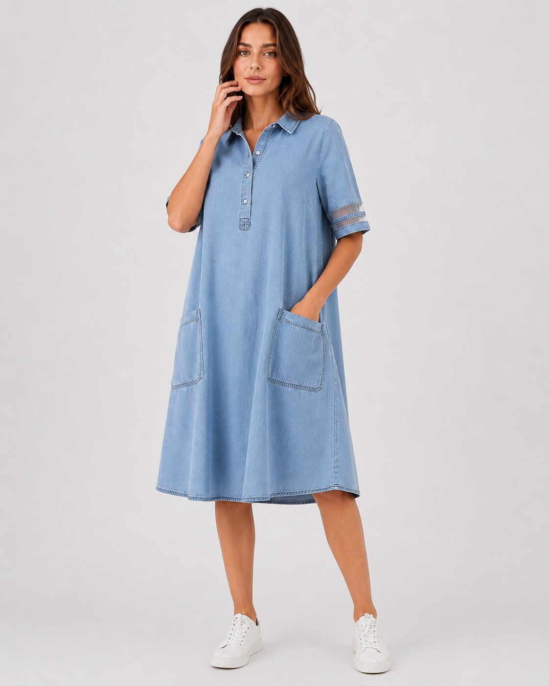 Women's denim shirt midi dress with a relaxed silhouette, button-front design, and soft denim fabric. A versatile casual dress ideal for everyday wear, styled with sneakers, sandals, or boots.