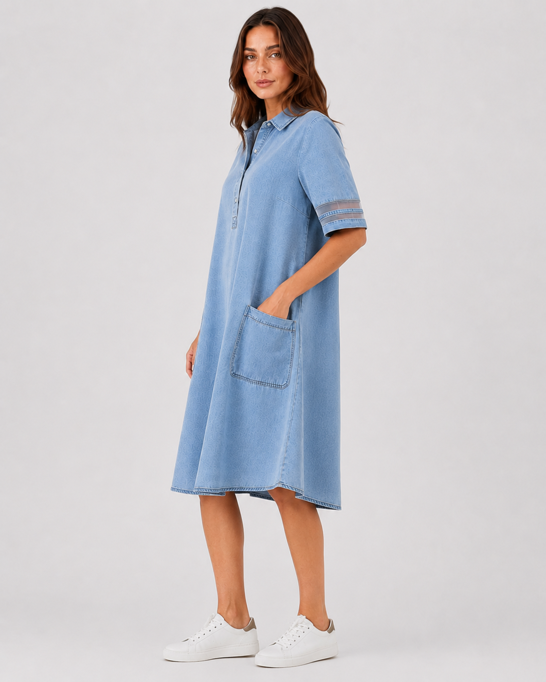 Women's denim shirt midi dress with a relaxed silhouette, button-front design, and soft denim fabric. A versatile casual dress ideal for everyday wear, styled with sneakers, sandals, or boots.