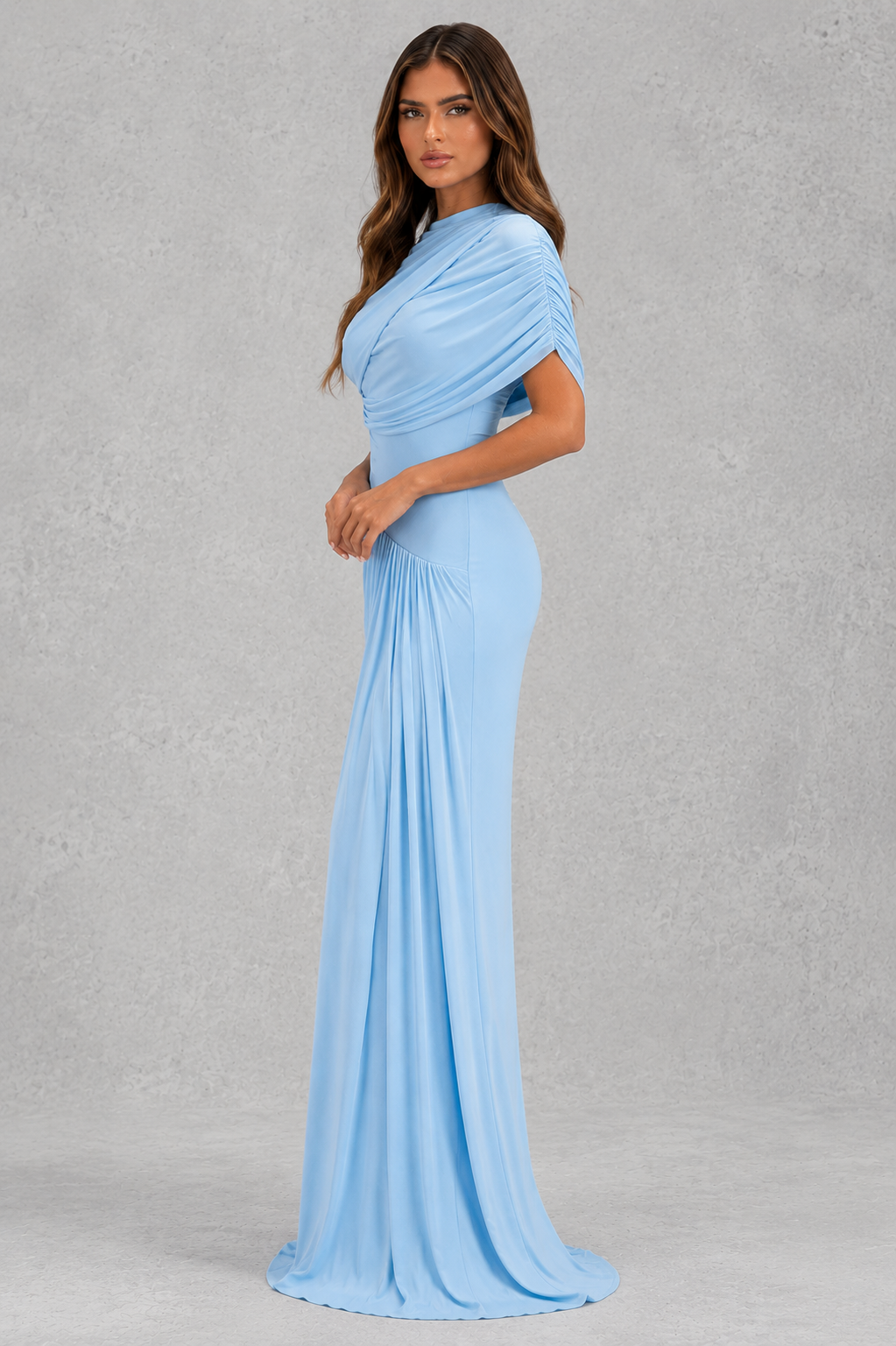 Baby blue women’s draped maxi dress with sculptural pleats, a crew neckline, sleeveless design, and elegant flowing shawl detail.