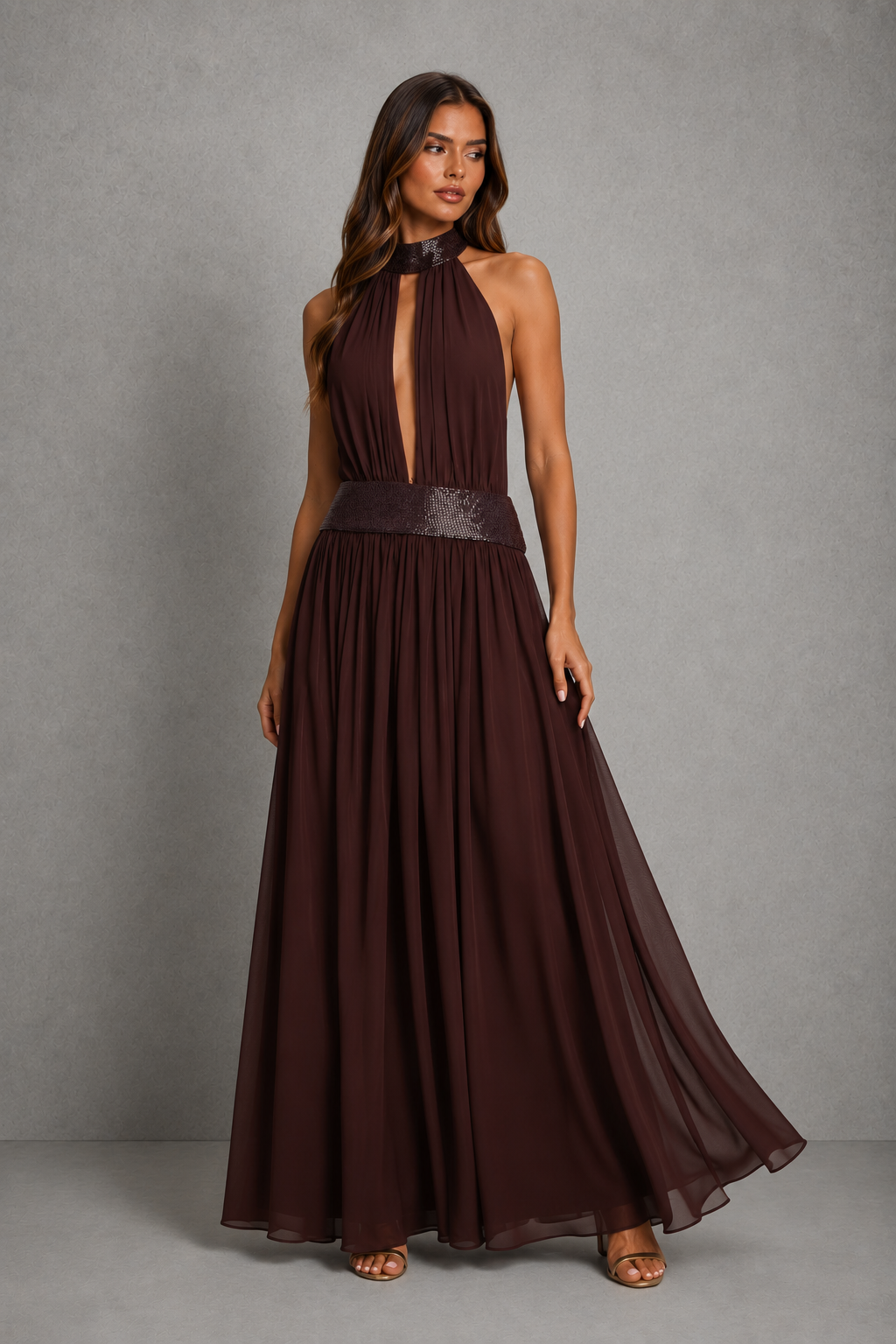 Women’s embellished halter chiffon maxi dress with deep plunge neckline, beaded waistband, open back and flowing floor-length skirt.